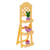 A yellow wooden dollhouse accessory set featuring a picket fence structure and various small medical and cleaning tools.