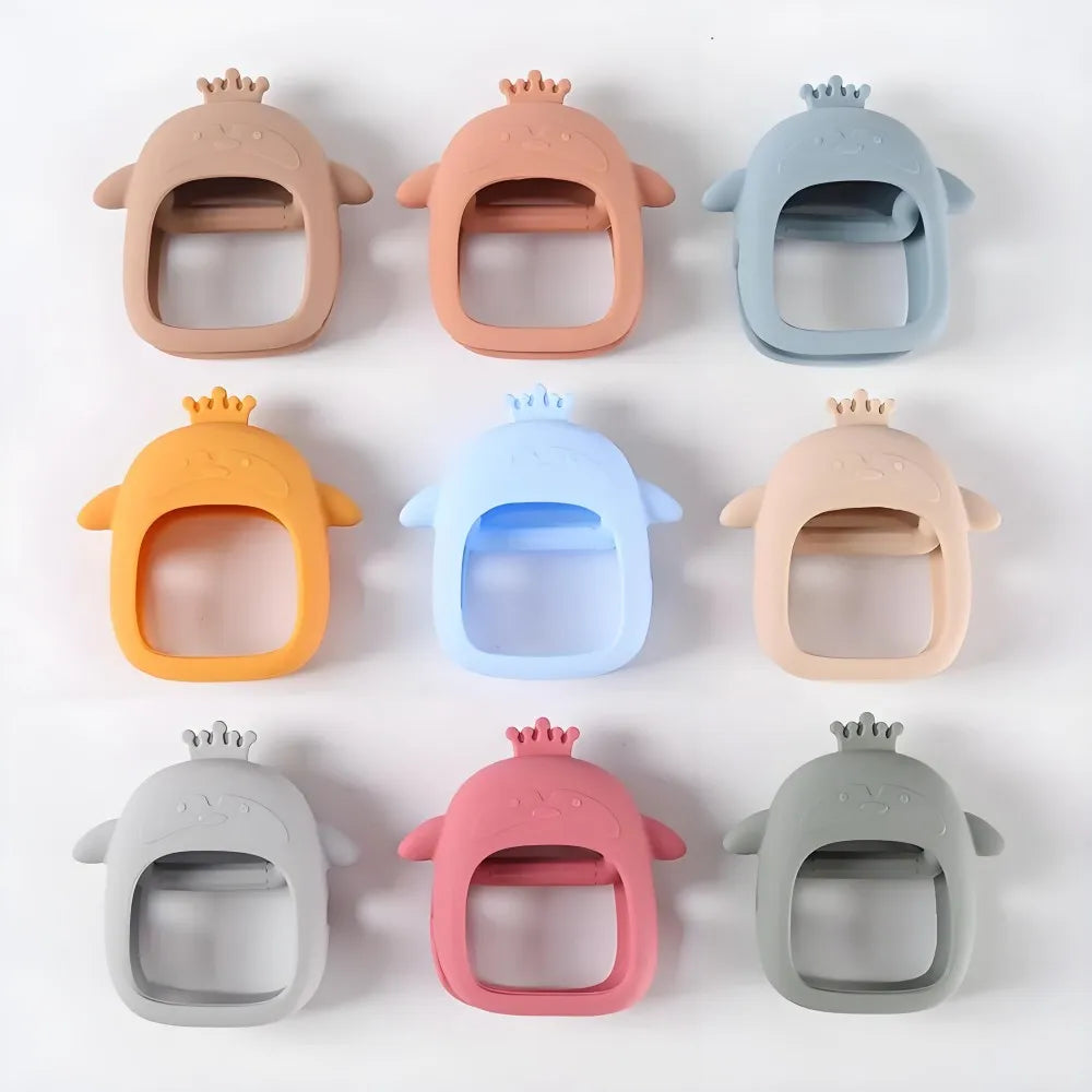 A collection of silicone hand-shaped teethers for babies in various pastel and neutral colors.