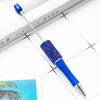 A blue and silver beaded ballpoint pen craft kit with a metal tip resting on a white surface.