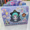 A packaged collectible figure of a cute, light blue and pink-haired doll with a glowing effect.