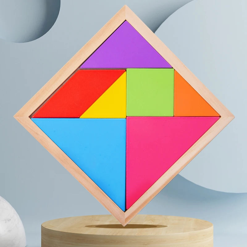 A wooden tangram puzzle set with seven colored pieces arranged in a diamond shape on a light background.
