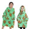 A young girl models a bright green fuzzy hoodie sweater with orange and yellow cat designs.