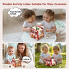 Two toddlers interact with a wooden activity cube toy on a table and outdoors.