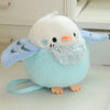 A soft, light blue cartoon bird plush with white feathers and orange beak, designed as a keychain.