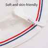 Close-up of a white baby bib with red and blue stripes, showing the soft fabric texture.