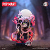 A collectible blind box figure of a Demon Slayer character with pink flames and a large white sphere.