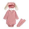 A pink rabbit romper set for babies includes a matching hat and socks.