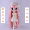A pink Blyth fashion doll with long hair and a white dress, displayed against a light background.