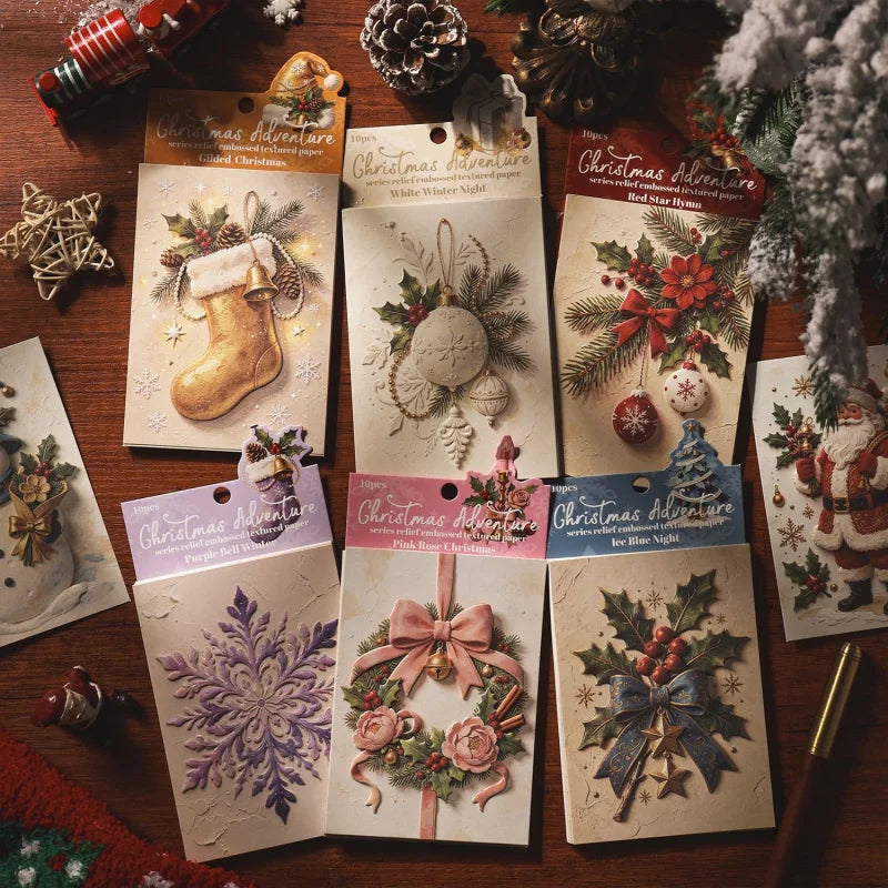 A collection of embossed Christmas advent paper sheets featuring festive designs like reindeer, wreaths, and holiday scenes.