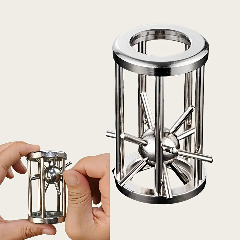 A hand holds a multi-layer stainless steel puzzle cage brain teaser with multiple spiky rods.