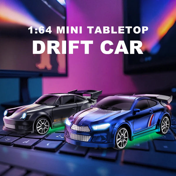 A blue drift car model is displayed on a keyboard, set against a blurred background with computer screens.