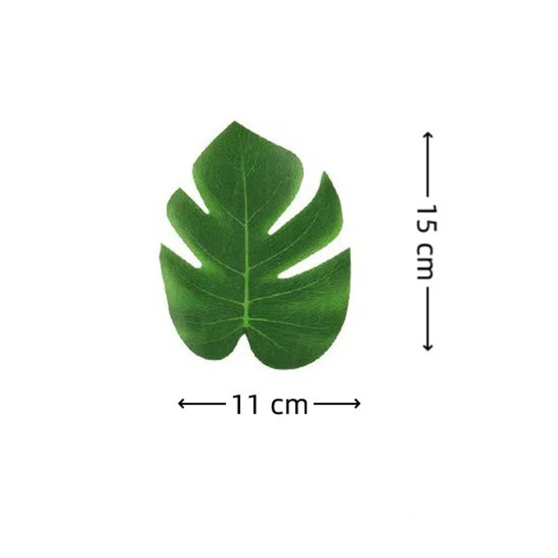 Green artificial tropical palm and monstera leaves with dimensions of 15 cm by 11 cm