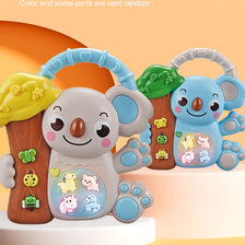A Koala cartoon animal keyboard piano with lights and sounds is shown on a wooden stand.