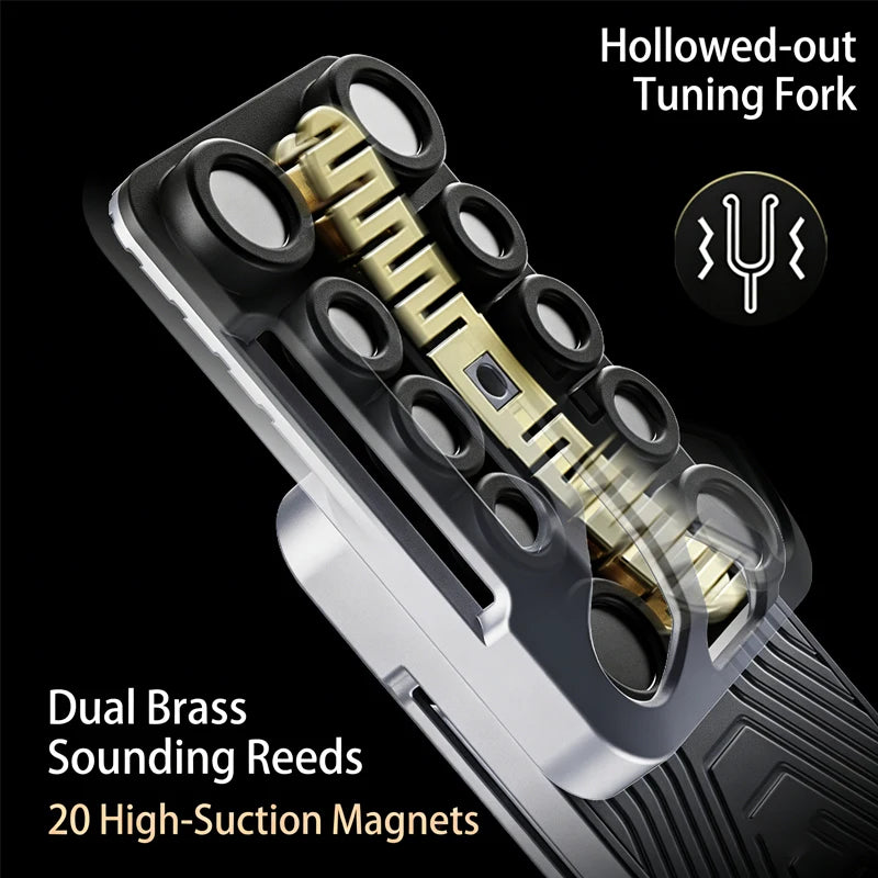 A close-up of a hollowed-out tuning fork with dual brass sounding reeds and 20 high-suction magnets.