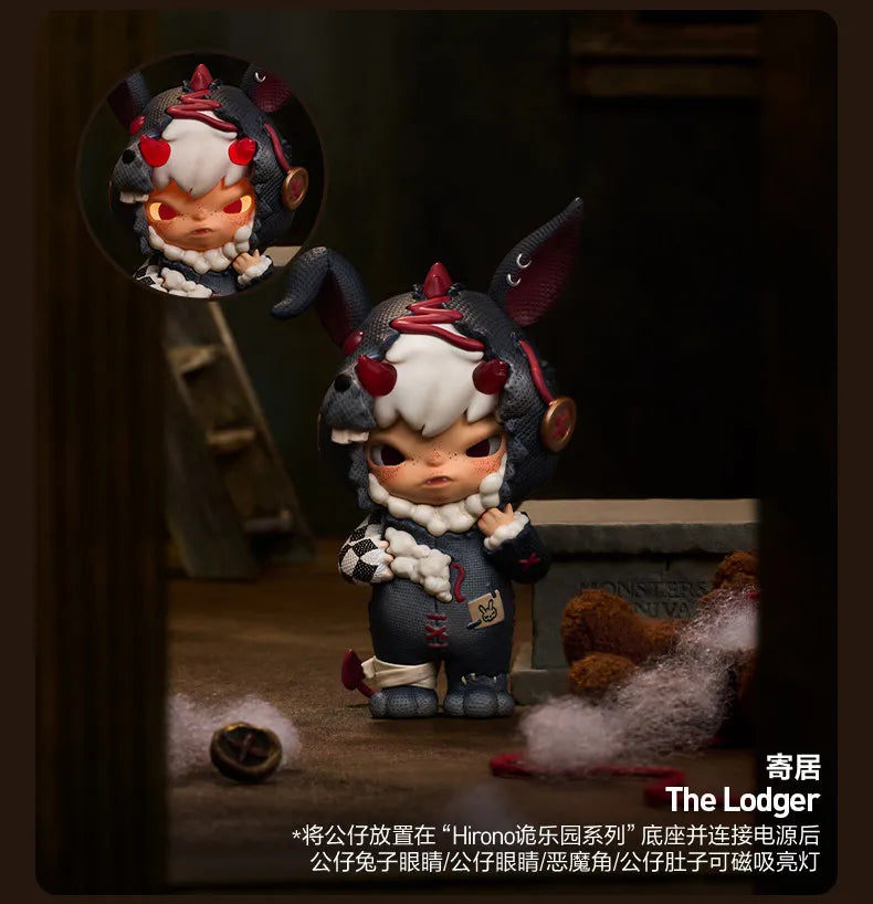 A dark-colored collectible figure blind box featuring a mischievous cat character with white fur and red accents.