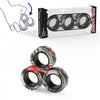 A box and three magnetic fidget rings in black and red camouflage patterns for anxiety relief.