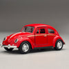 A red classic retro Beetle diecast model car with chrome accents and a black tire on a gray background.