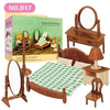 A miniature dollhouse furniture set featuring a wooden bed, dresser, mirror, and chair in brown tones.