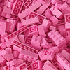 A pile of pink building blocks and bricks for creative DIY projects