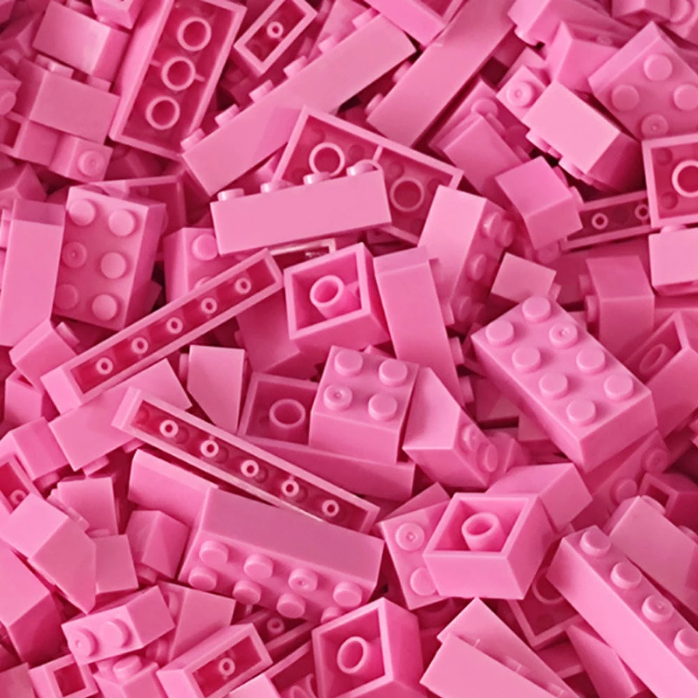 A pile of pink building blocks and bricks for creative DIY projects