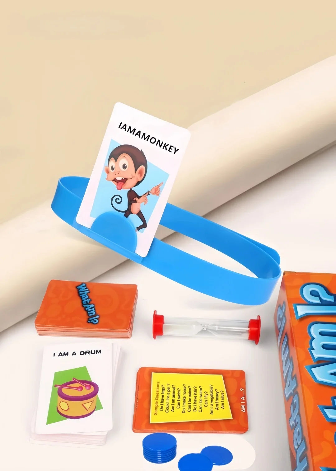 A set of Guess Who I Am cards and a wooden board game component are displayed on a white surface.