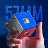 A hand holds a blue and red magnetic 3x3 speed cube puzzle against a dark blue technical background.