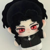 A black anime plush doll with large red eyes and dark hair.