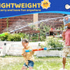 A family is playing outdoors with long range water blaster squirt guns in a garden setting.