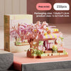 Pink micro building block set featuring a floral scene and a house structure for tabletop decor