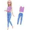 A fashion doll outfit set featuring a pink and purple striped top and matching blue plaid pants.