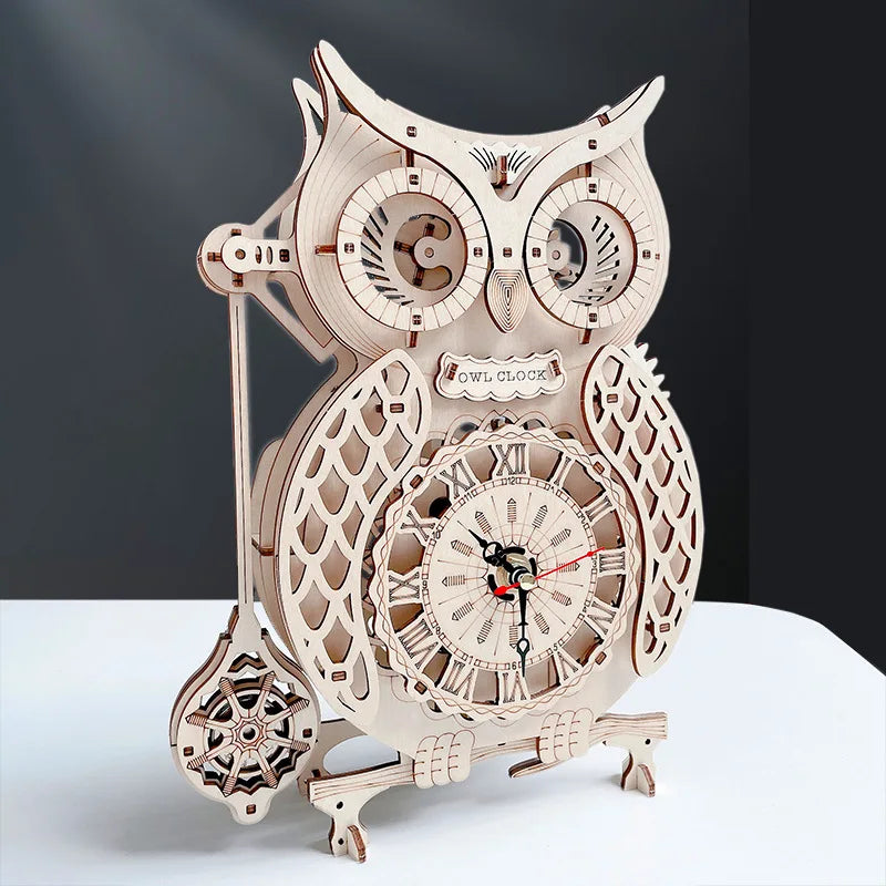 A detailed wooden owl wall clock made from a DIY assembly kit, featuring intricate carvings and gears.