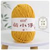 A ball of golden yellow chenille yarn labeled with Chinese characters for knitting and crochet.