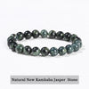 A bracelet made of natural New Kambaba Jasper stone, featuring dark green and black mottled colors.