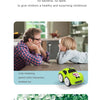 A father is interacting with his child who is playing with a yellow RC car.