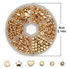 A circular plastic tray holds a variety of gold and silver-plated beads for jewelry making.