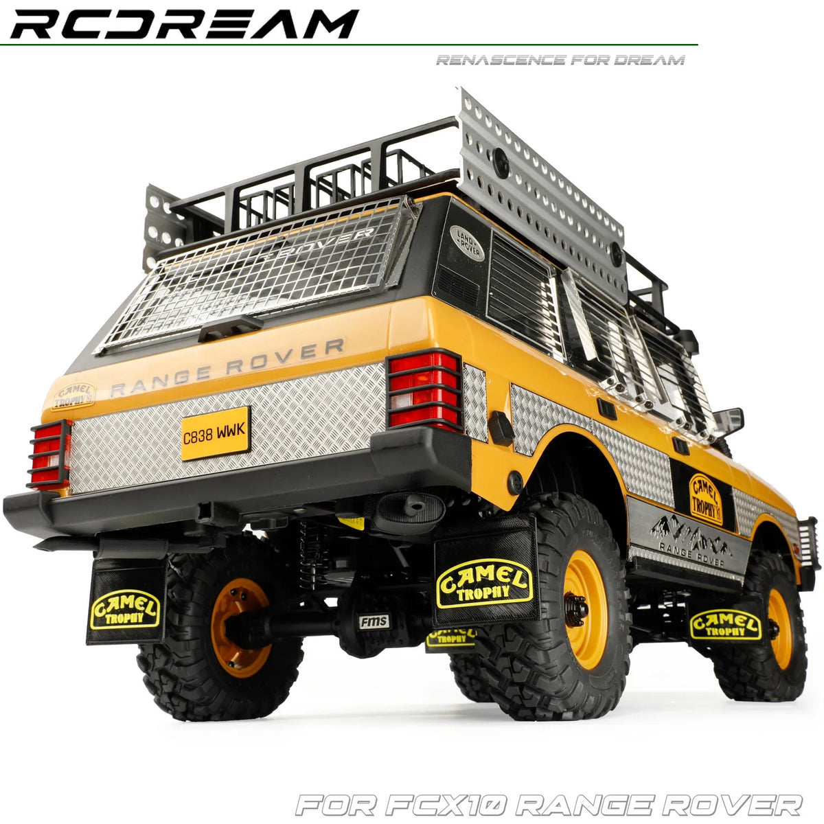 A yellow RC Range Rover model with black accessories and mud flaps for an upgrade kit.