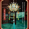 A detailed 3D metal phoenix crown model kit with colorful feathers and dangling elements displayed on a dark background.