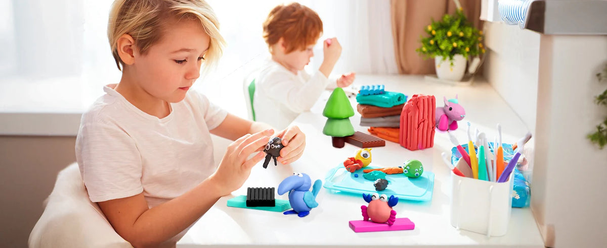 A young girl is crafting with a 24-color polymer clay set and carving tools on a white table.