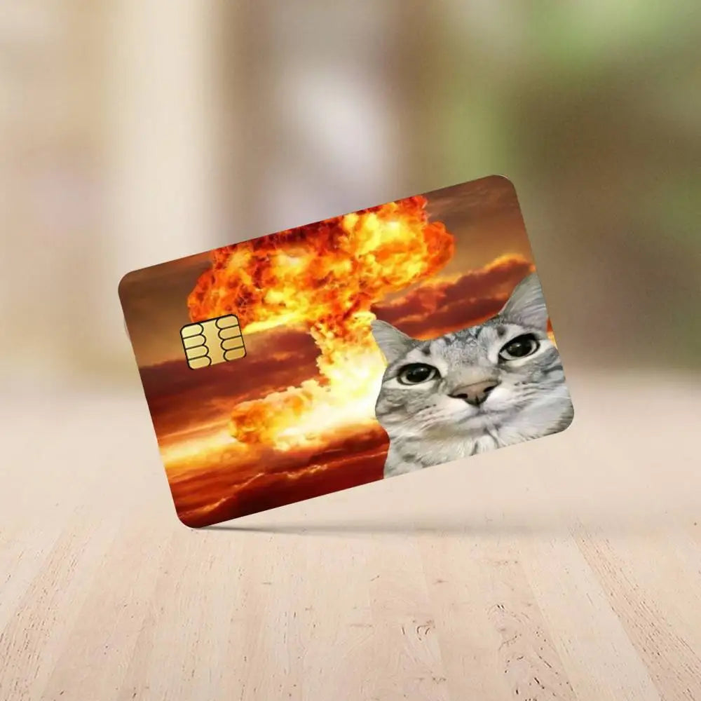 A card featuring a cat face silhouette against a background of fiery orange and yellow clouds.