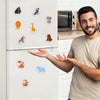 A man is displaying a set of ten colorful animal fridge magnets on a white refrigerator.