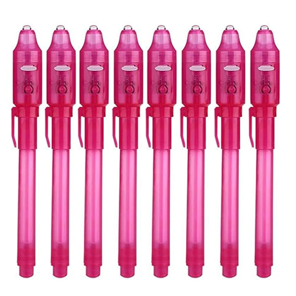 A set of pink invisible ink spy pens with UV light for writing secret messages