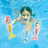Four mermaid dive toys in various colors are splashing in blue water.
