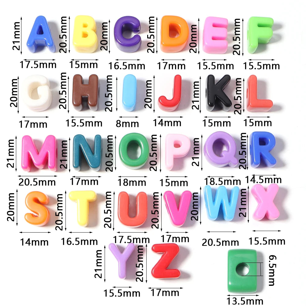 A display of colored acrylic alphabet beads arranged in a grid, showing various letters from A to Z.