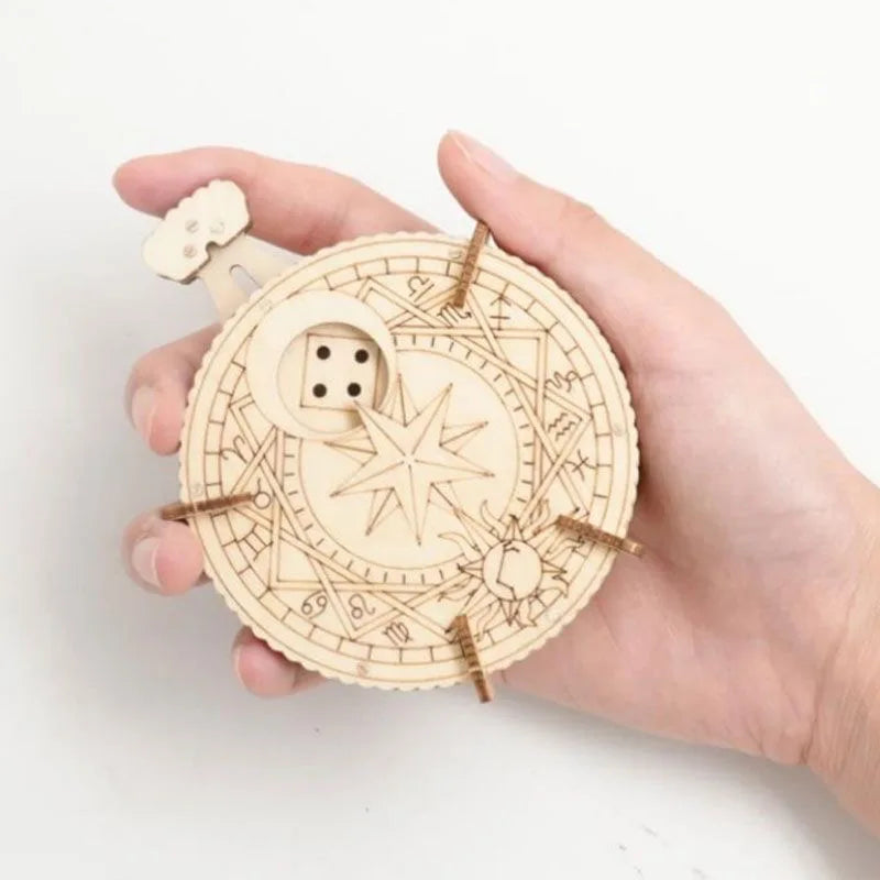 A hand holds a circular wooden puzzle kit with intricate star and geometric designs.