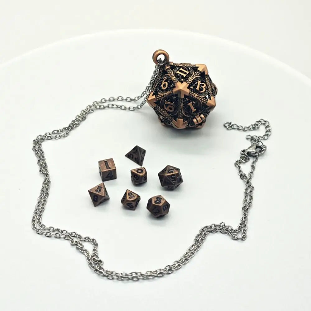 A bronze metal polyhedral dice set with a pendant storage case displayed on a white background.