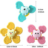 A set of two spinning bath toys featuring cute animal figures in light blue and pink colors.