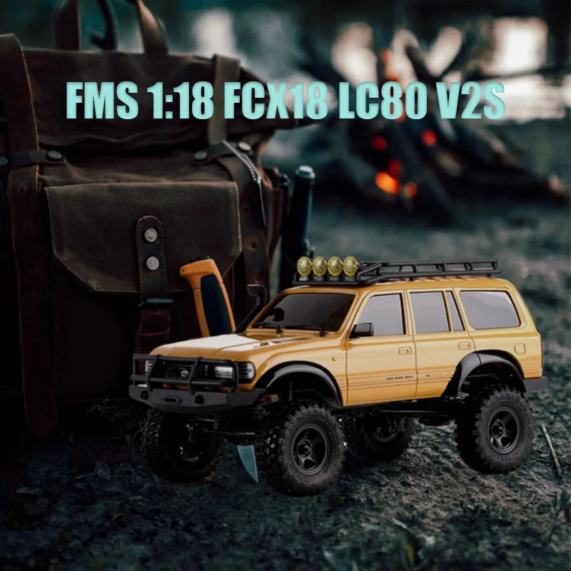 A yellow 1:18 scale remote control off-road climbing car with a roof rack is shown outdoors.