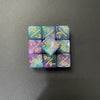 A set of ten dual-color dice showing positive and negative values, arranged in a grid.