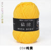 A ball of bright yellow milk cotton yarn labeled 09# 황전 for knitting and crochet.