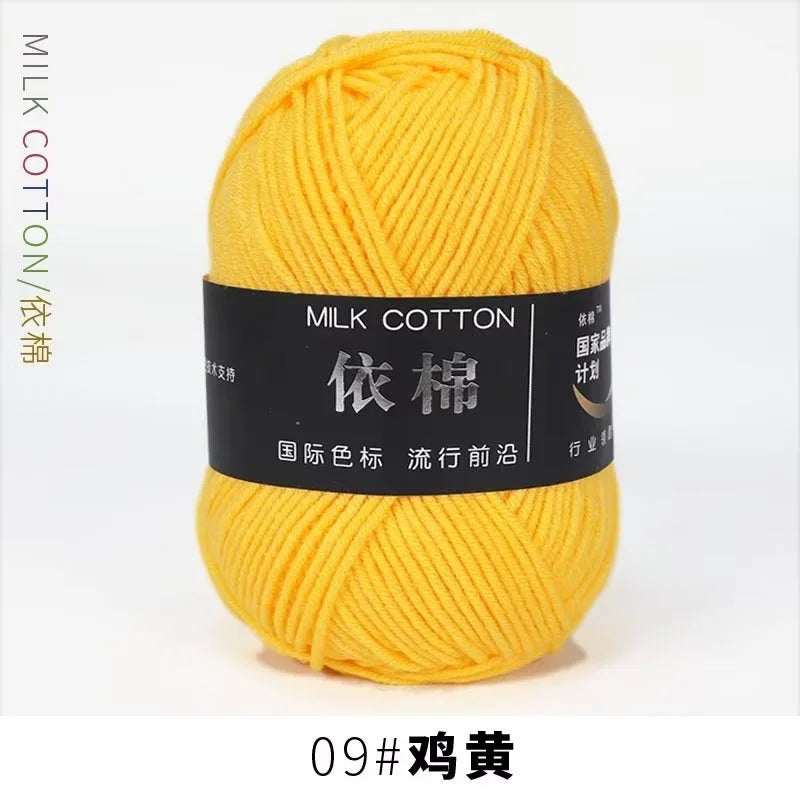 A ball of bright yellow milk cotton yarn labeled 09# 황전 for knitting and crochet.
